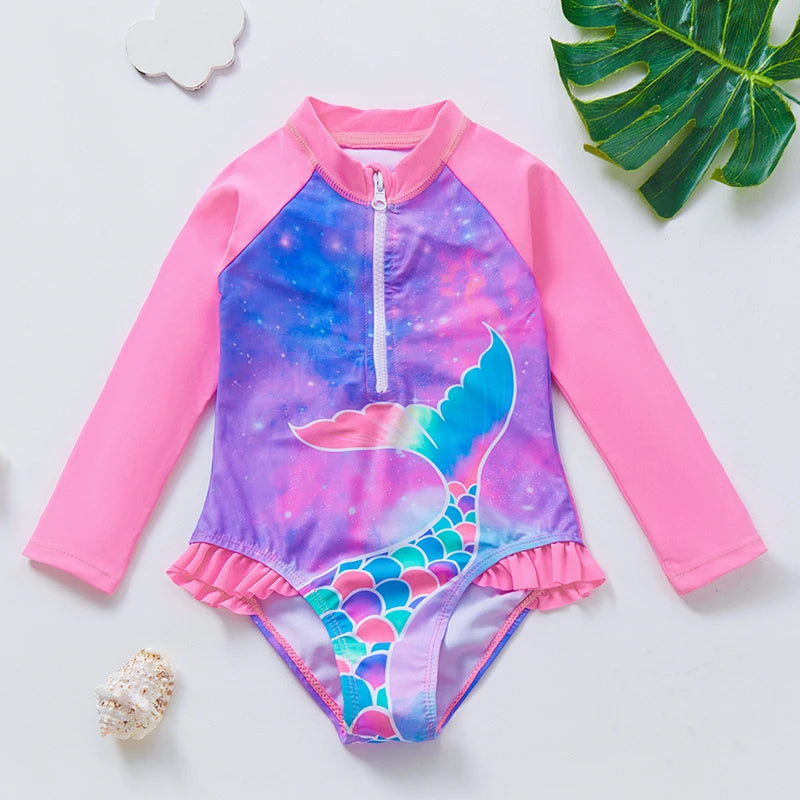 Long sleeve swimwear with ruffle trim.