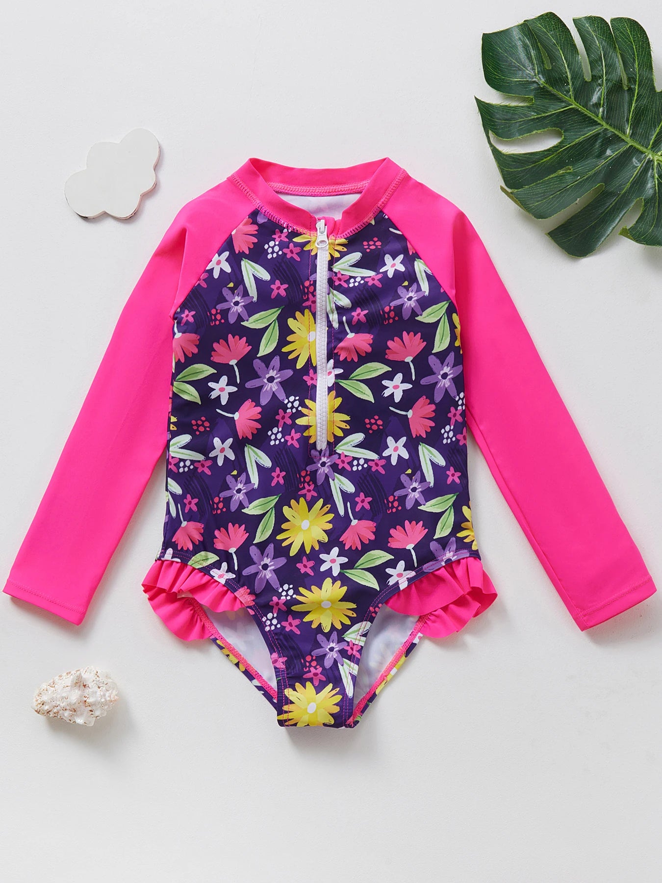 Long sleeve swimwear with ruffle trim.